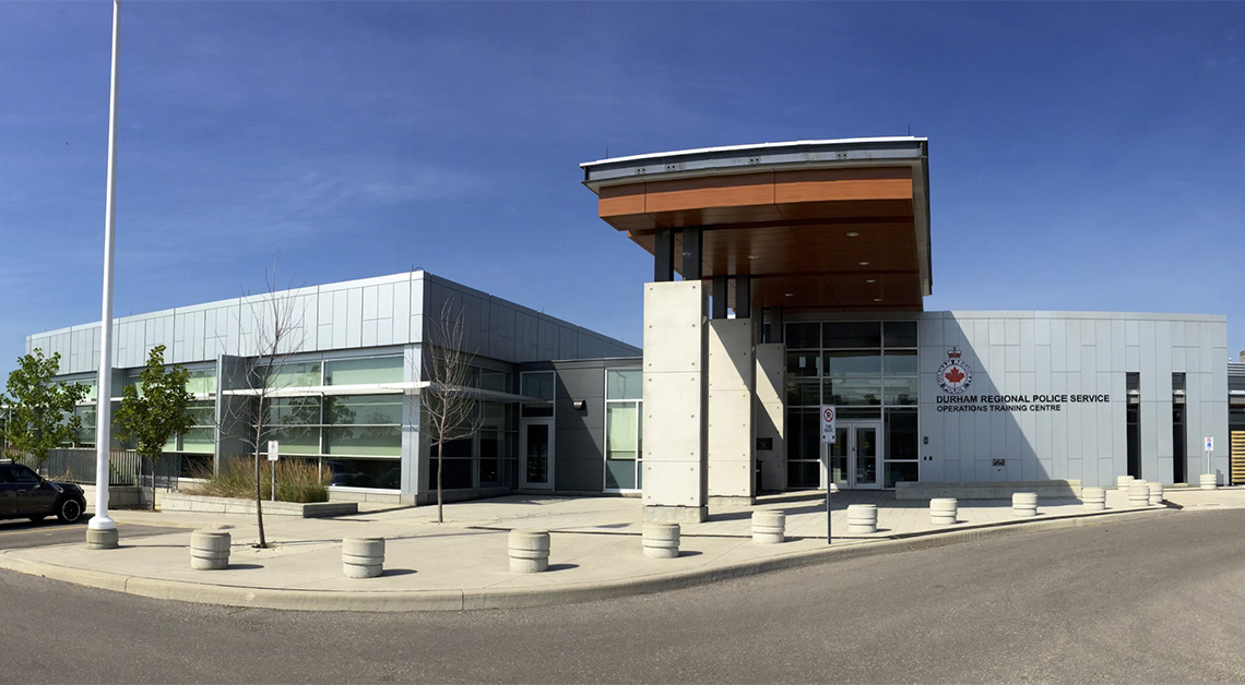 Exterior view of the Durham Police Station in Ontario, featuring a secure and modern design with cladding made of Aluminum Composite Panels (ACM panels)
