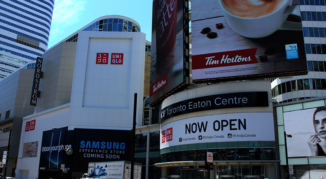 Uniqlo clothing retailer at Eaton Centre in Toronto, Canada, showcasing a modern storefront design with cladding made of Aluminum Composite Panels (ACM panels)
