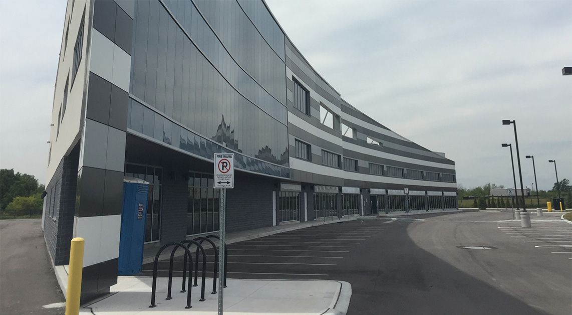Exterior view of The Milani Industrial Condominiums located on 133 Milani Boulevard in Ontario, Canada, featuring a facade with Aluminum Composite Panels (ACM panels) cladding material
